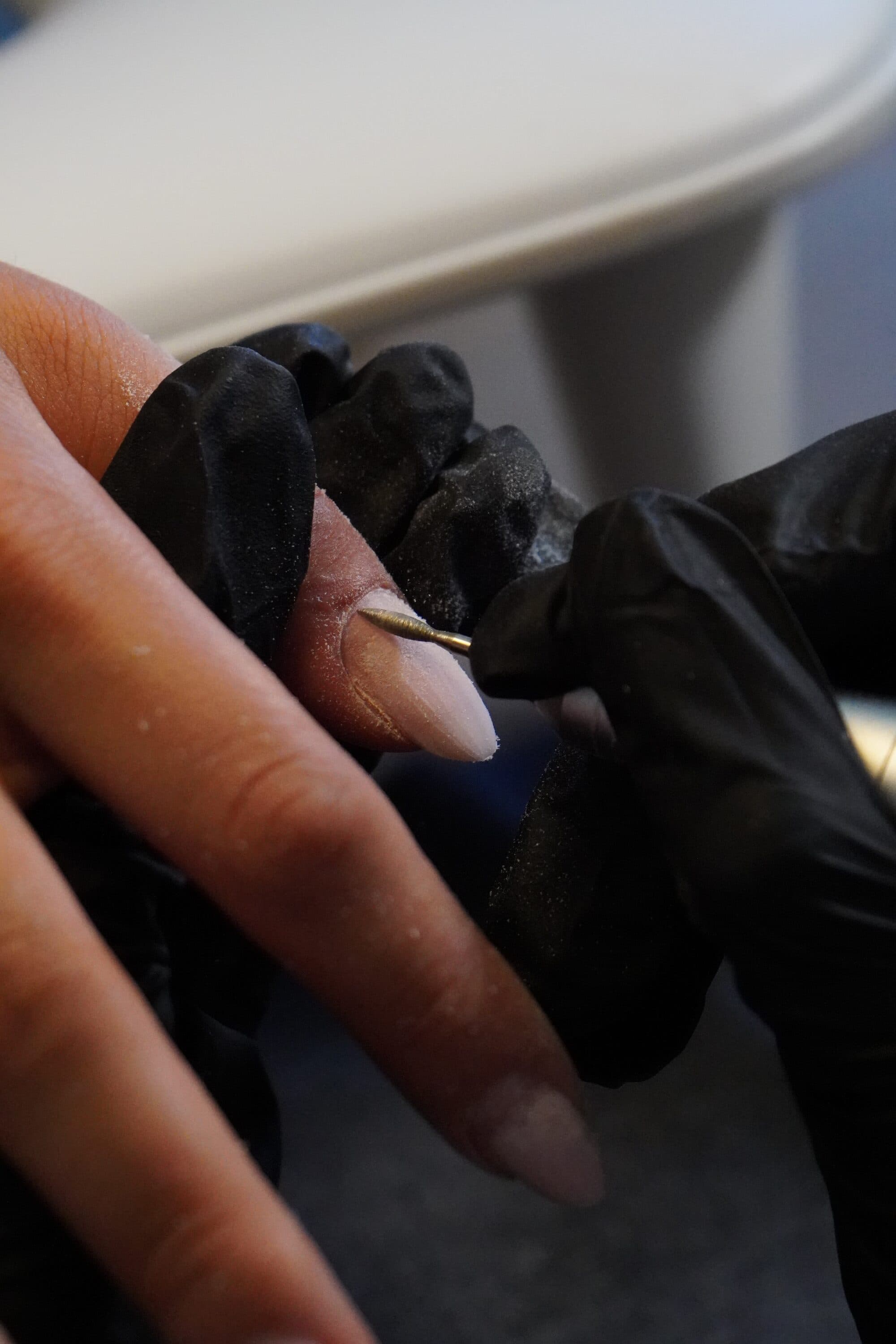 Russian manicure in progress at Doll Nails